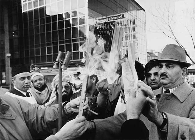 Muslims burn copies of Salman Rushdie’s "Satanic Verses" in Bradford, U.K., in 1988. (DEREK HUDSON/GETTY IMAGES)
