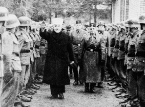 Ideological politics: the Grand Mufti of Jerusalem salutes Bosnian Muslim recruits to the Waffen-SS in 1943.